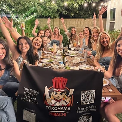 Hibachi catering service at a private party with friends posing for a group photo